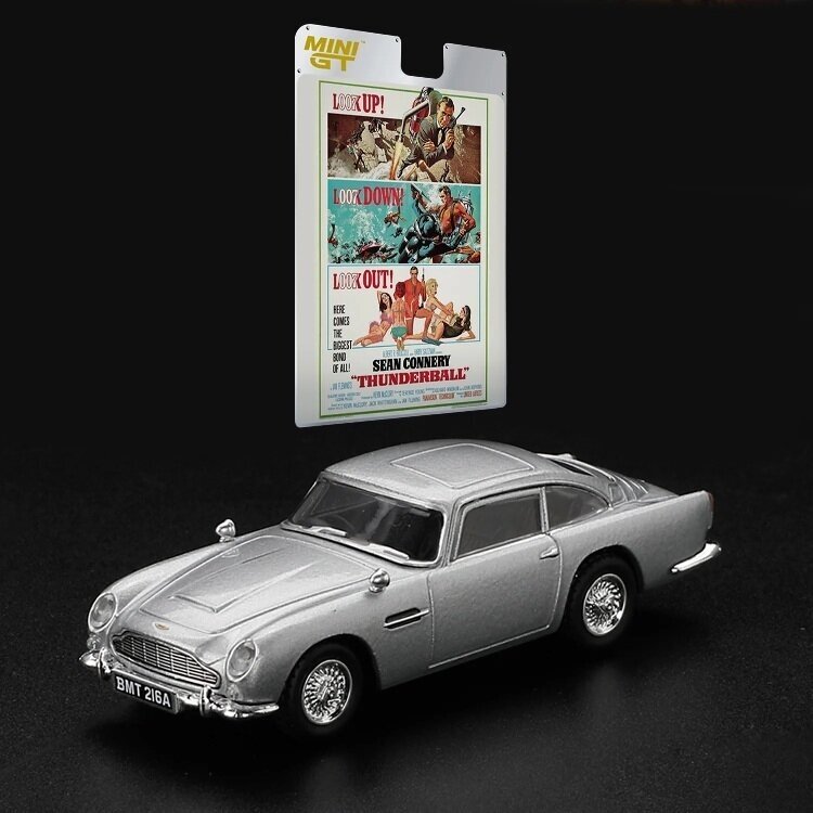 MINI GT Modeliukas 1/64 1965 Aston Martin DB5 *Thunderball* Spanish Blister Packaging, silver (yra Sandėlyje)