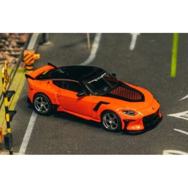 Tarmac Modeliukas 1/64 Nissan VeilSide FFZ400 Fairlady Z, orange (yra Sandėlyje) Tarmac Modeliukas 1/64 Nissan VeilSide FFZ400 Fairlady Z, orange (yra Sandėlyje)