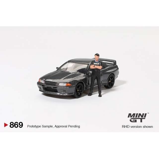 Mini GT 1/64 1992 Nissan Skyline GT-R (R32) Nismo with Tsugio Matsuda Figure, gunmetal